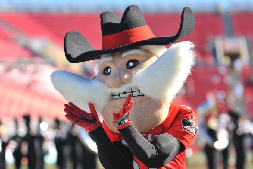 Hey Reb! framing his mustache in front of the UNLV band